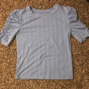 So womens light blue ribbed ruffled sleeve top.